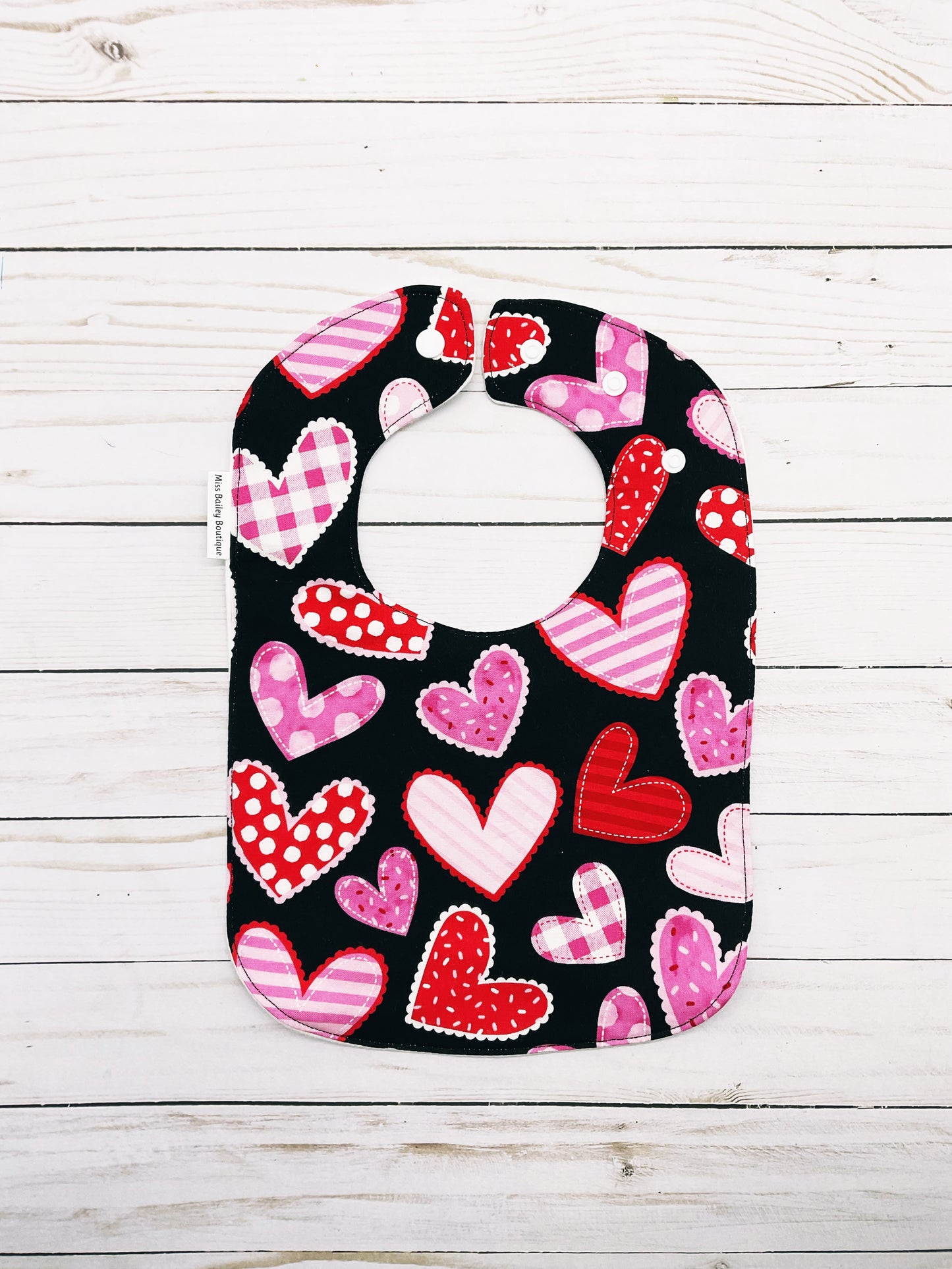 Hearts on Black Valentines Bib