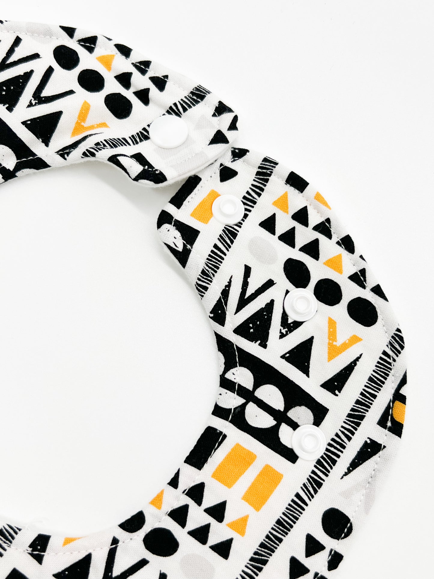 Black and Yellow Geometric Feeding Bib
