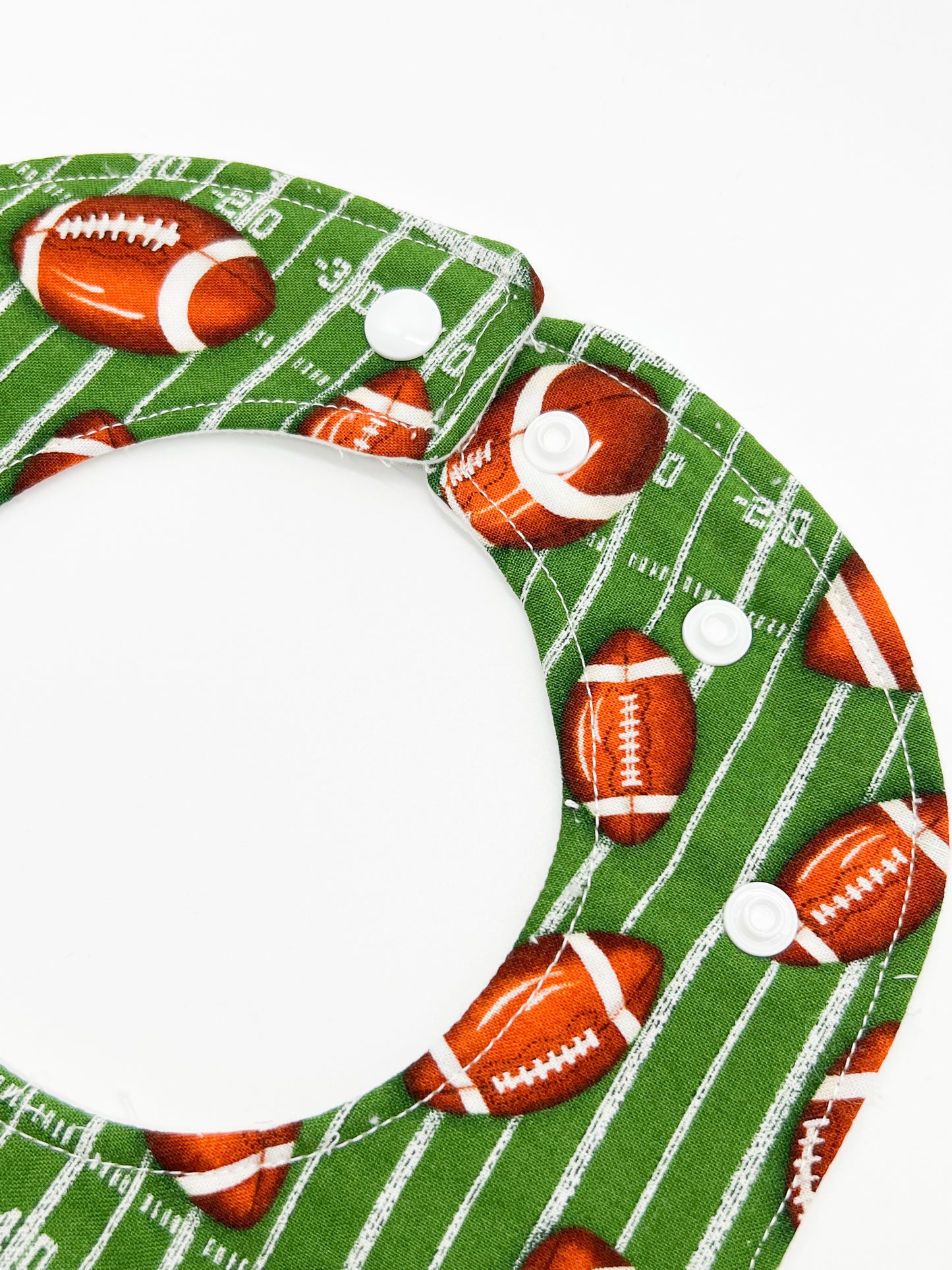 Tossing Footballs Feeding Bib