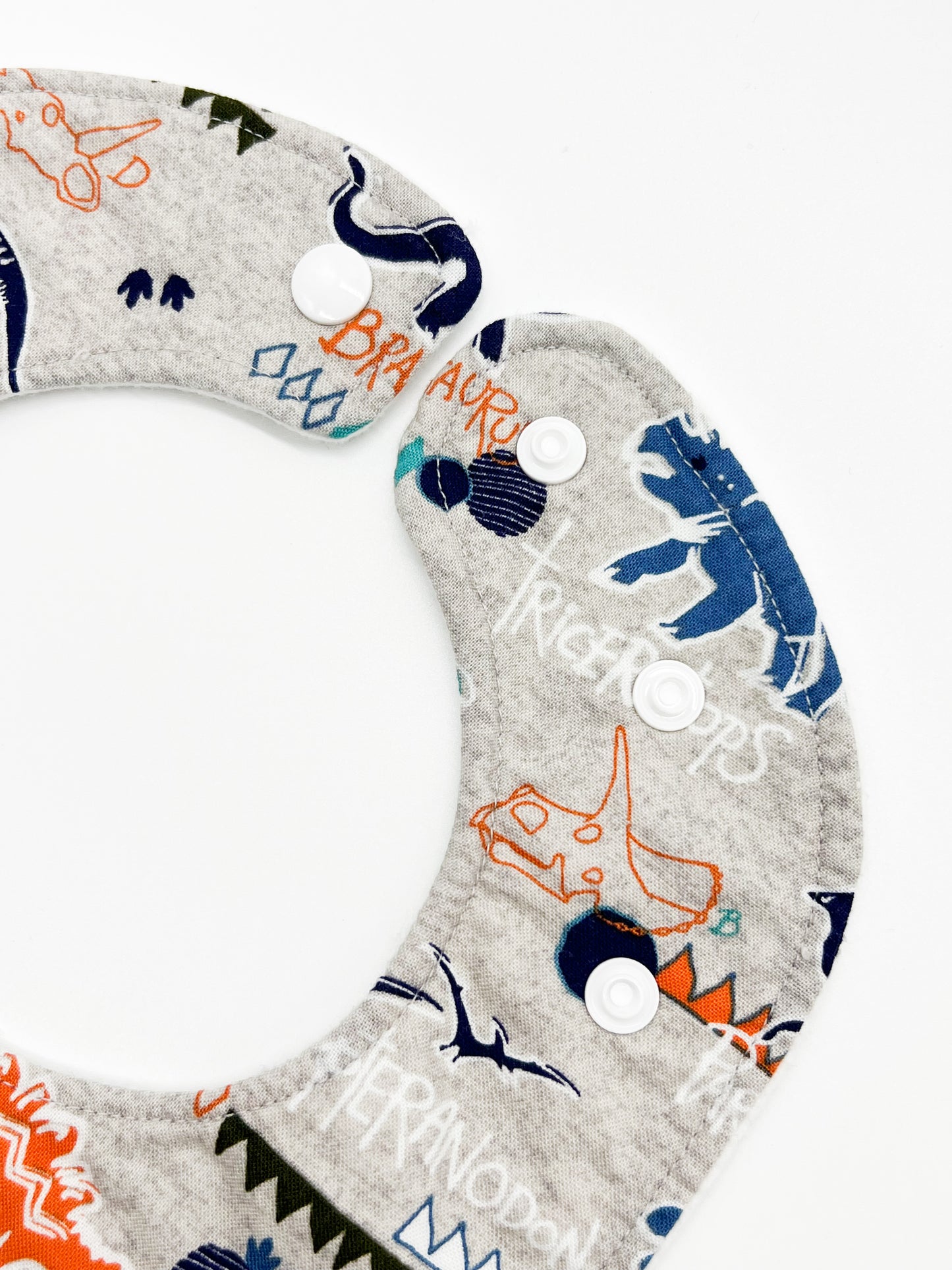 Dinosaurs on Gray Feeding Bib